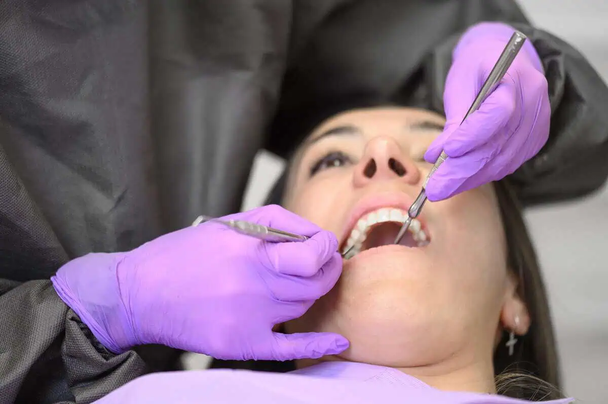 A woman is receiving Smile Makeover Treatment in Los Altos, CA & Lehi, UT at Peninsula Center of Cosmetic Dentistry